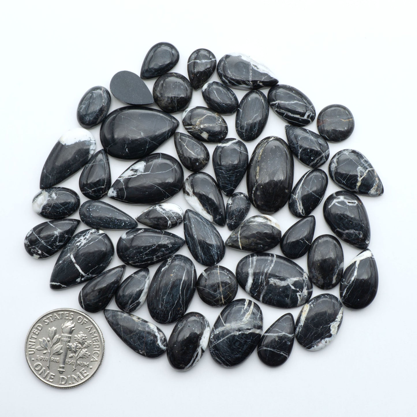 Natural White Buffalo Stone Cabochons are semi-precious gemstones cut into shapes ideal for jewelry-making, making them an excellent choice for artisans.

