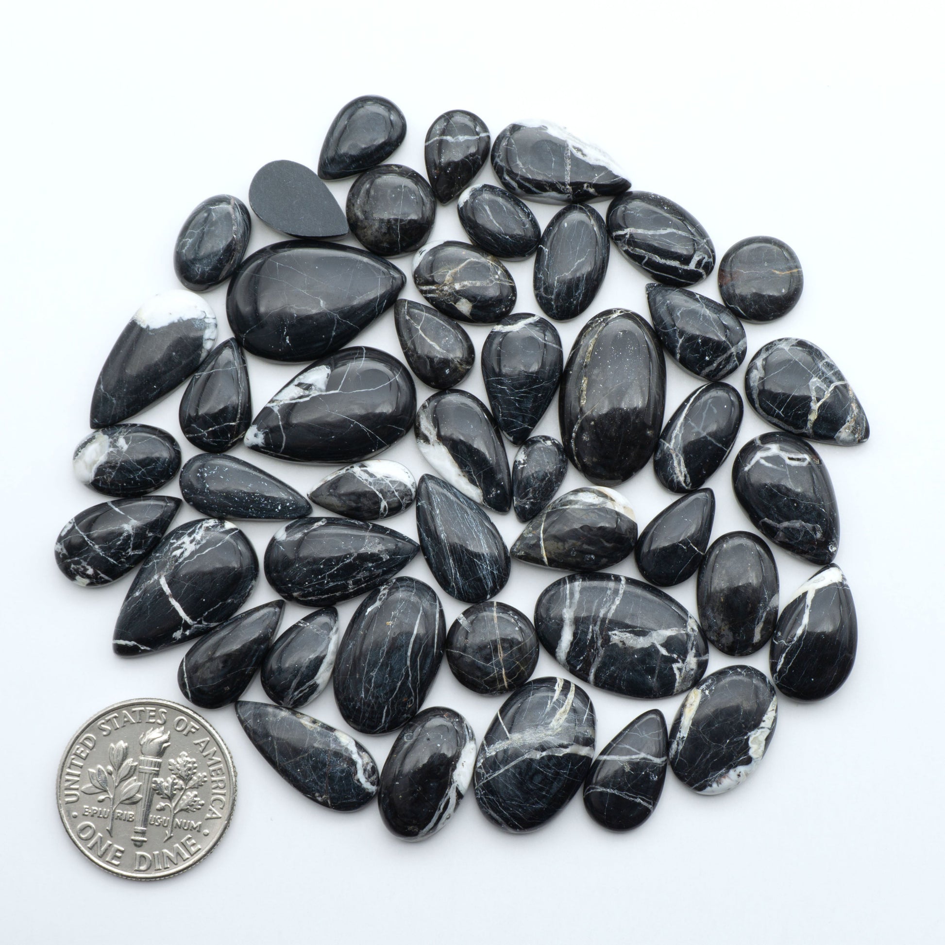 Natural White Buffalo Stone Cabochons are semi-precious gemstones cut into shapes ideal for jewelry-making, making them an excellent choice for artisans.

