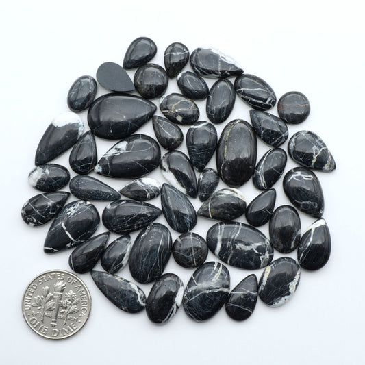 Natural White Buffalo Stone Cabochons are semi-precious gemstones cut into shapes ideal for jewelry-making, making them an excellent choice for artisans.

