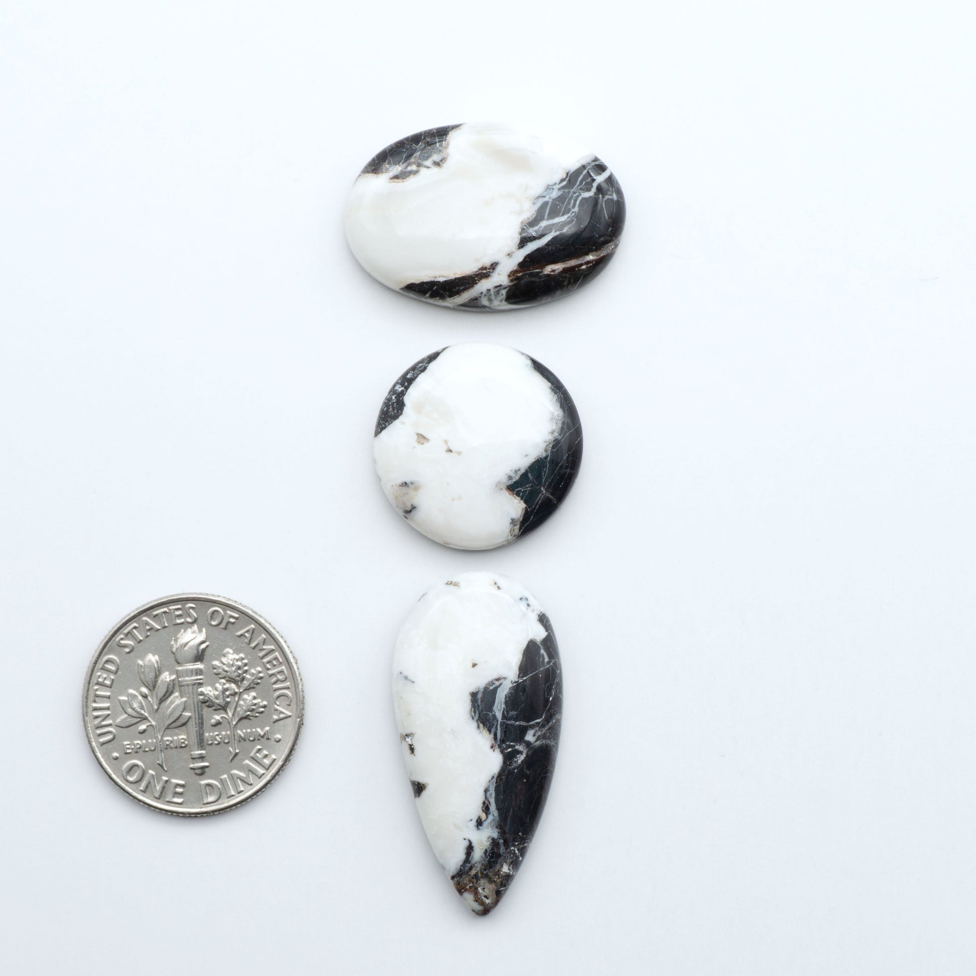 Natural White Buffalo Stone Cabochons are semi-precious gemstones cut into shapes ideal for jewelry-making, making them an excellent choice for artisans.

