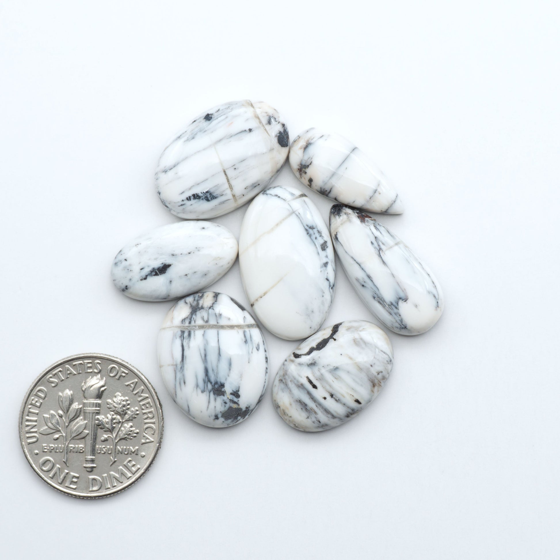 Natural White Buffalo Stone Cabochons are semi-precious gemstones cut into shapes ideal for jewelry-making, making them an excellent choice for artisans.

