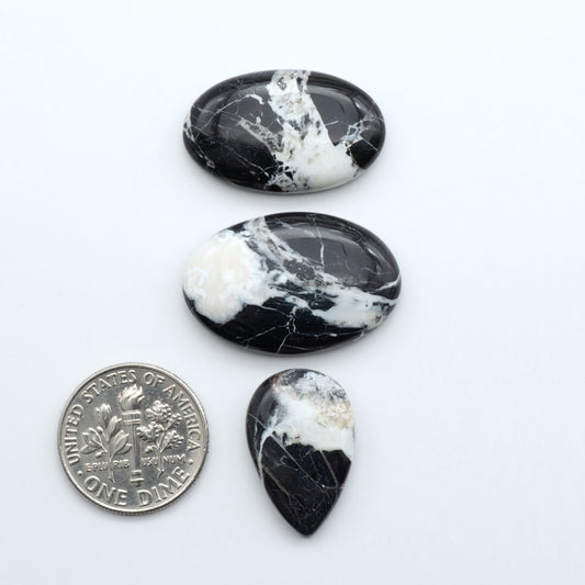 Natural White Buffalo Stone Cabochons are semi-precious gemstones cut into shapes ideal for jewelry-making, making them an excellent choice for artisans.

