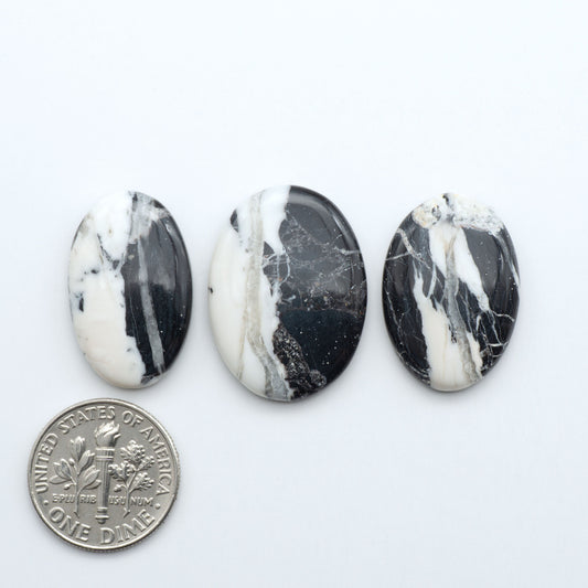 Natural White Buffalo Stone Cabochons are semi-precious gemstones cut into shapes ideal for jewelry-making, making them an excellent choice for artisans.
