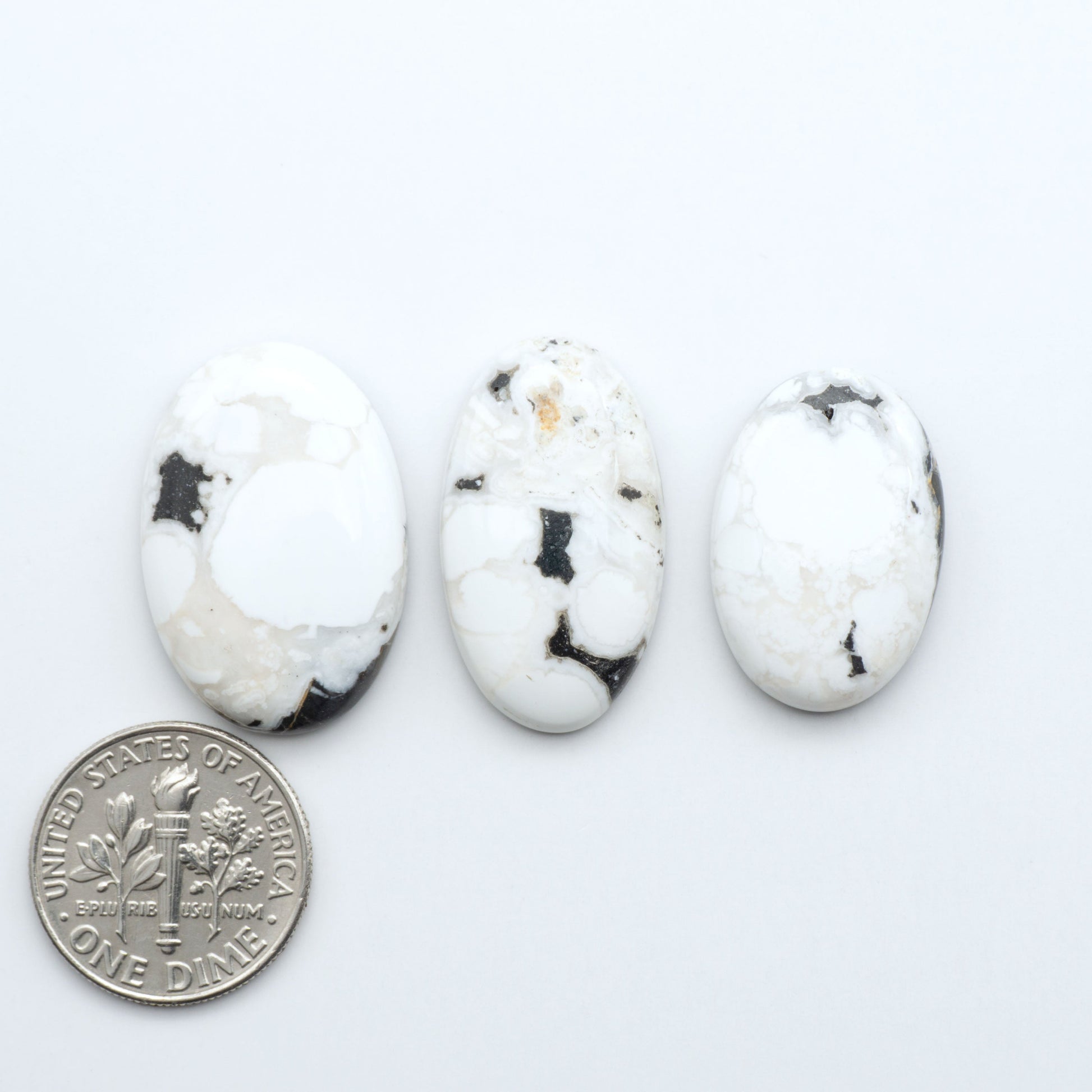 Natural White Buffalo Stone Cabochons are semi-precious gemstones cut into shapes ideal for jewelry-making, making them an excellent choice for artisans.

