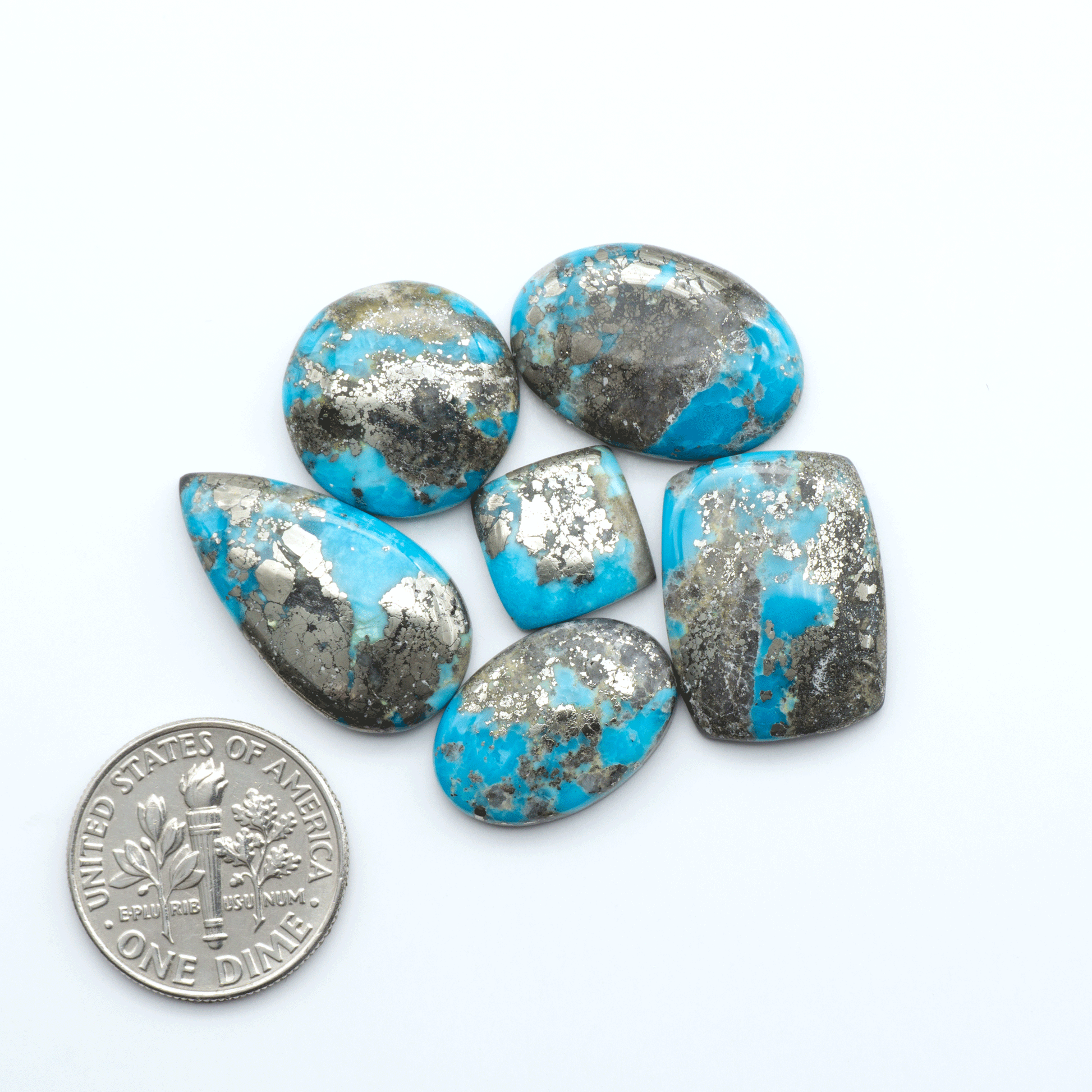 Nacozari turquoise cabochons are striking gemstones known for their vibrant blue to greenish-blue colors and pyrite, these stones are prized in jewelry making.
