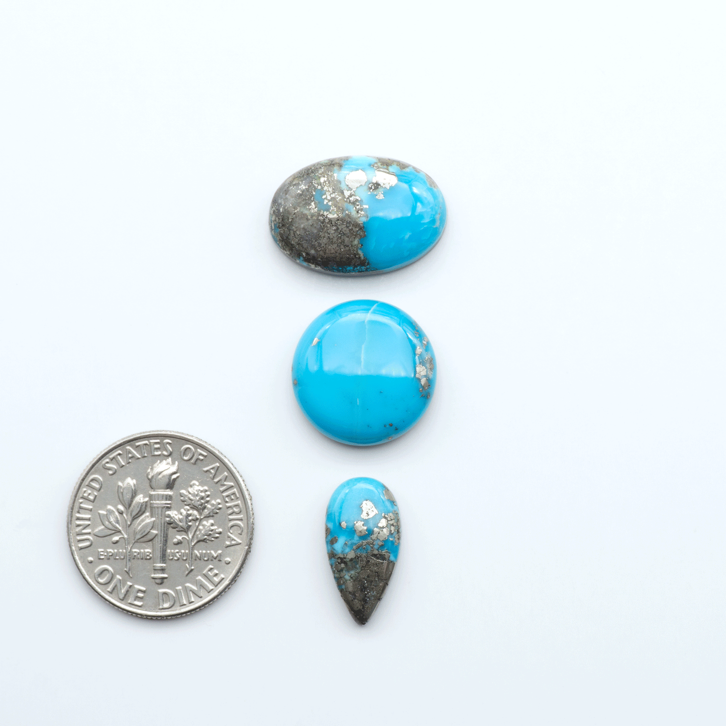 Nacozari turquoise cabochons are striking gemstones known for their vibrant blue to greenish-blue colors and pyrite, these stones are prized in jewelry making.