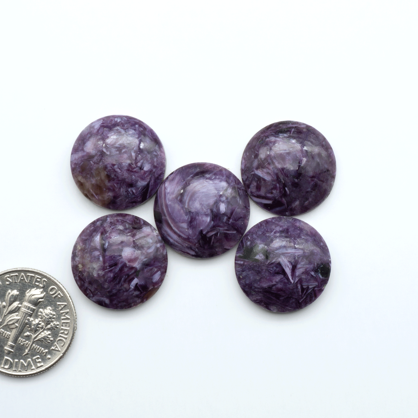 Shop natural Charoite cabochons with vivid violet swirls, perfect for jewelry makers and silversmiths creating rings, pendants, and custom designs.
