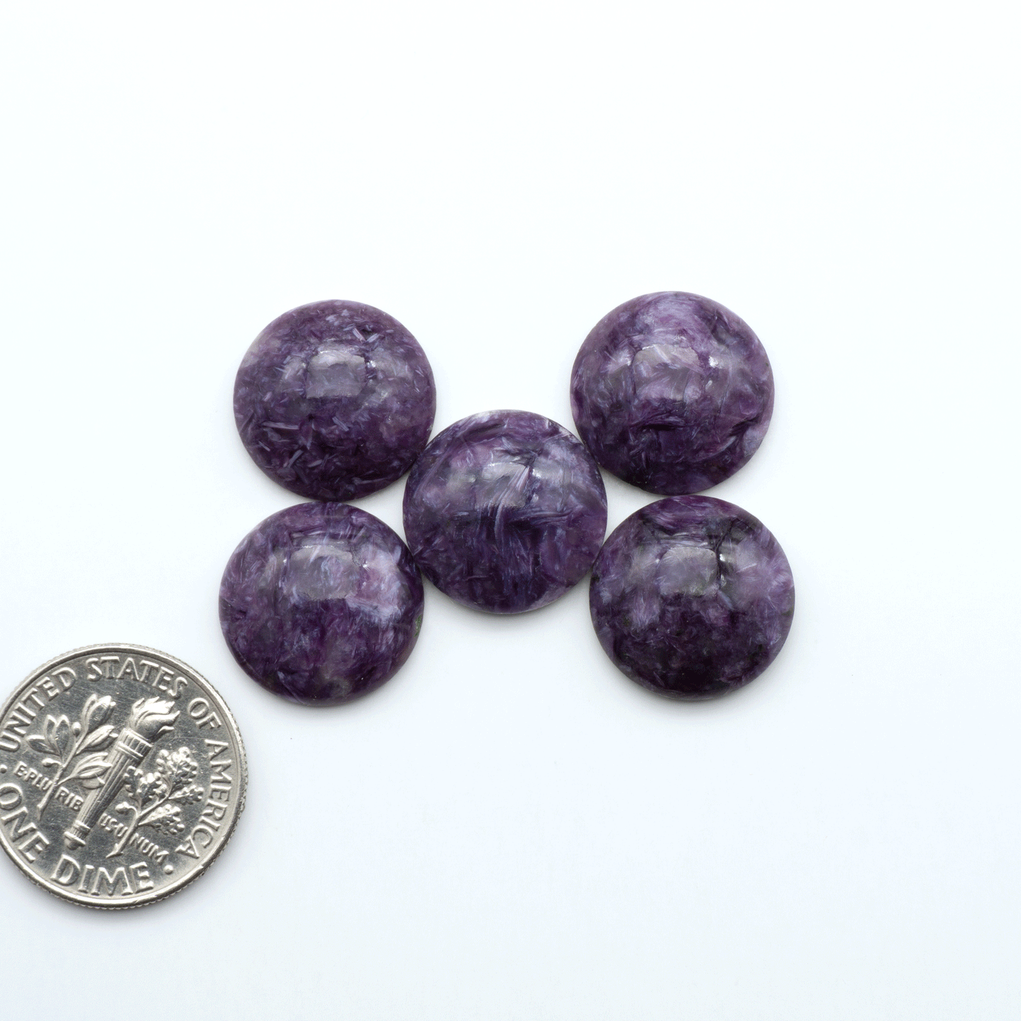 Shop natural Charoite cabochons with vivid violet swirls, perfect for jewelry makers and silversmiths creating rings, pendants, and custom designs.
