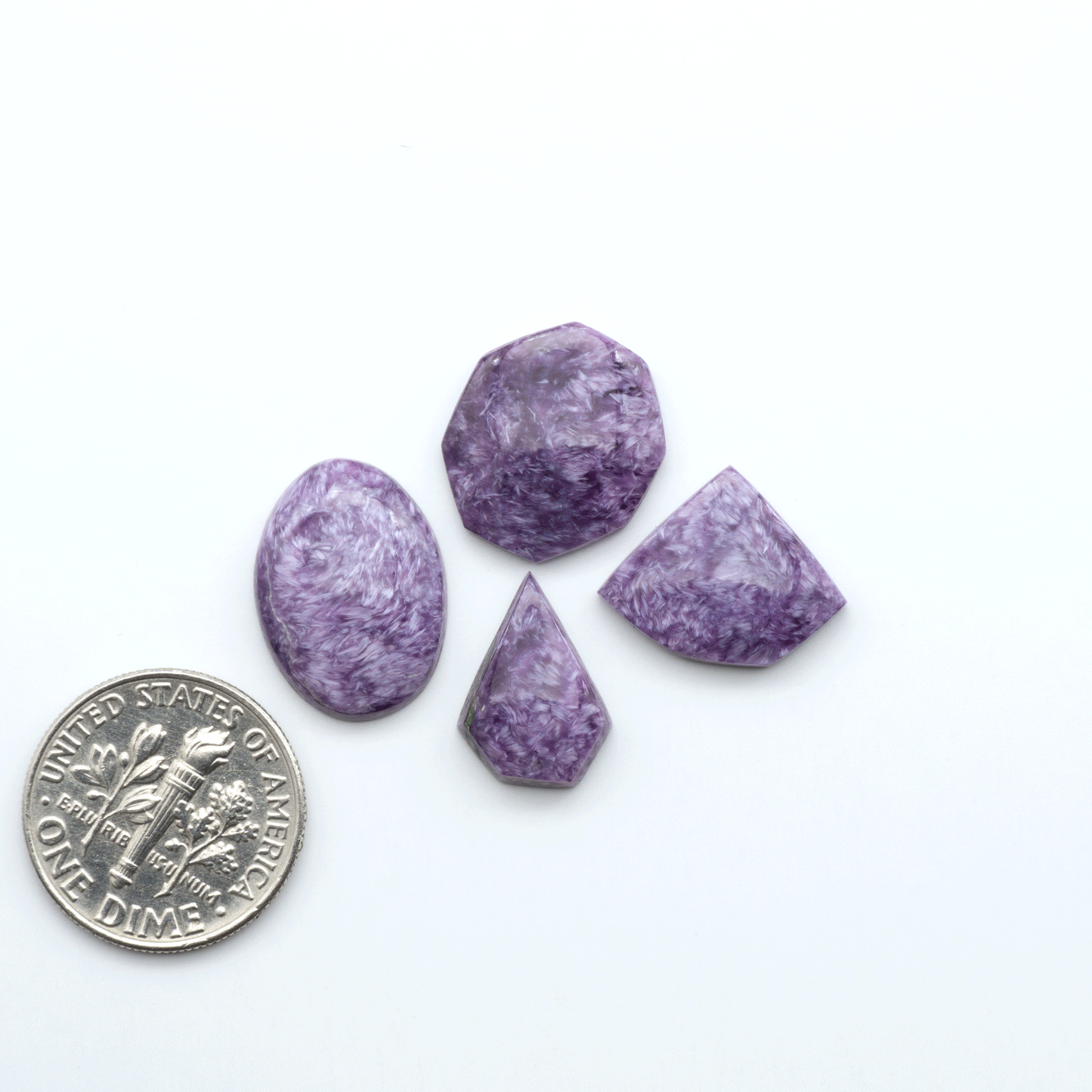 Shop natural Charoite cabochons with vivid violet swirls, perfect for jewelry makers and silversmiths creating rings, pendants, and custom designs.
