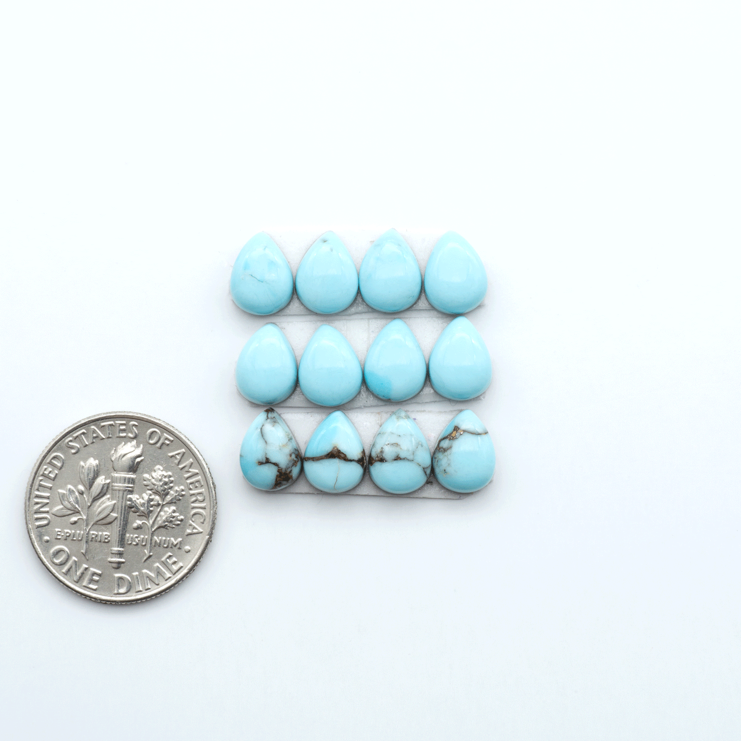 Enhance your jewelry designs with Pressed Turquoise Nugget Cabochons. Crafted from composite materials they add a captivating touch to your creations.