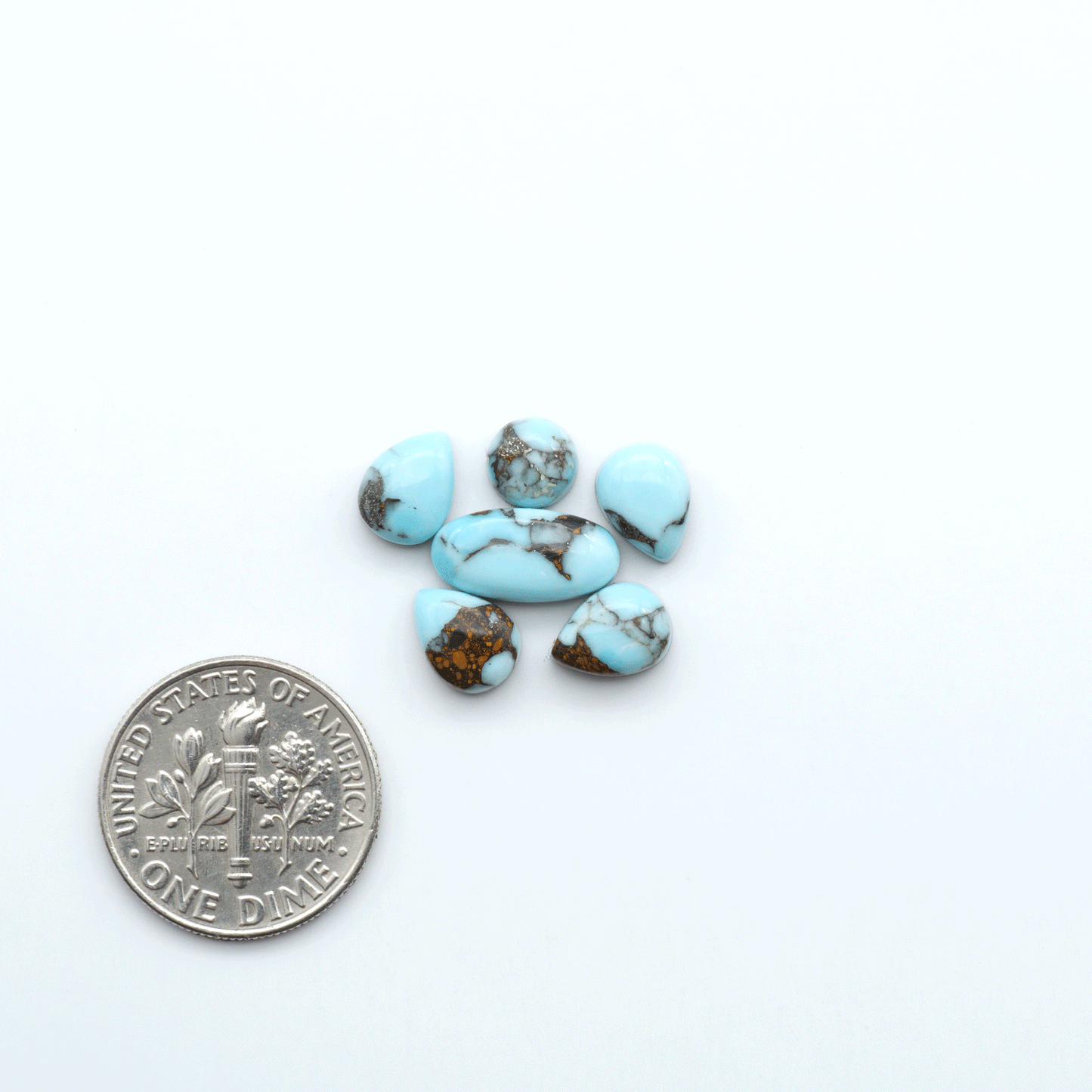 Enhance your jewelry designs with Pressed Turquoise Nugget Cabochons. Crafted from composite materials they add a captivating touch to your creations.