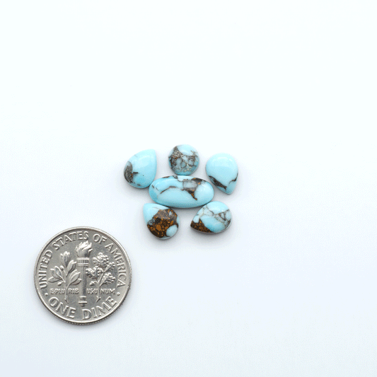 Enhance your jewelry designs with Pressed Turquoise Nugget Cabochons. Crafted from composite materials they add a captivating touch to your creations.