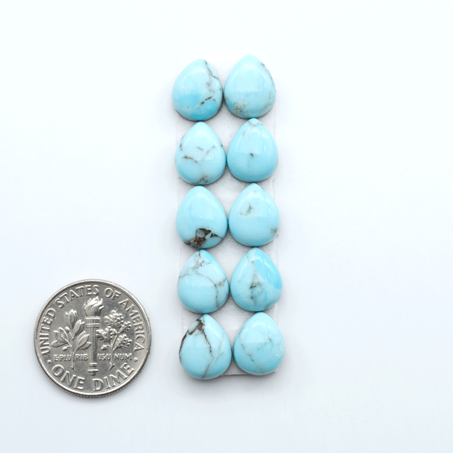 Enhance your jewelry designs with Pressed Turquoise Nugget Cabochons. Crafted from composite materials they add a captivating touch to your creations.
