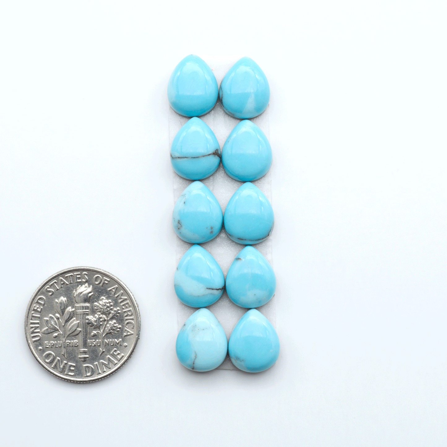 Enhance your jewelry designs with Pressed Turquoise Nugget Cabochons. Crafted from composite materials they add a captivating touch to your creations.