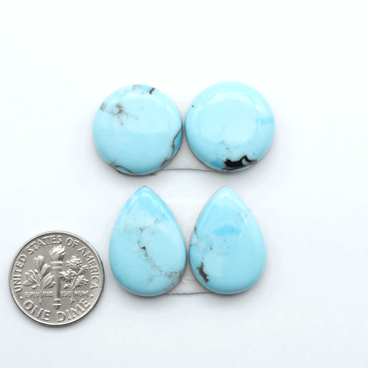 Enhance your jewelry designs with Pressed Turquoise Nugget Cabochons. Crafted from composite materials they add a captivating touch to your creations.