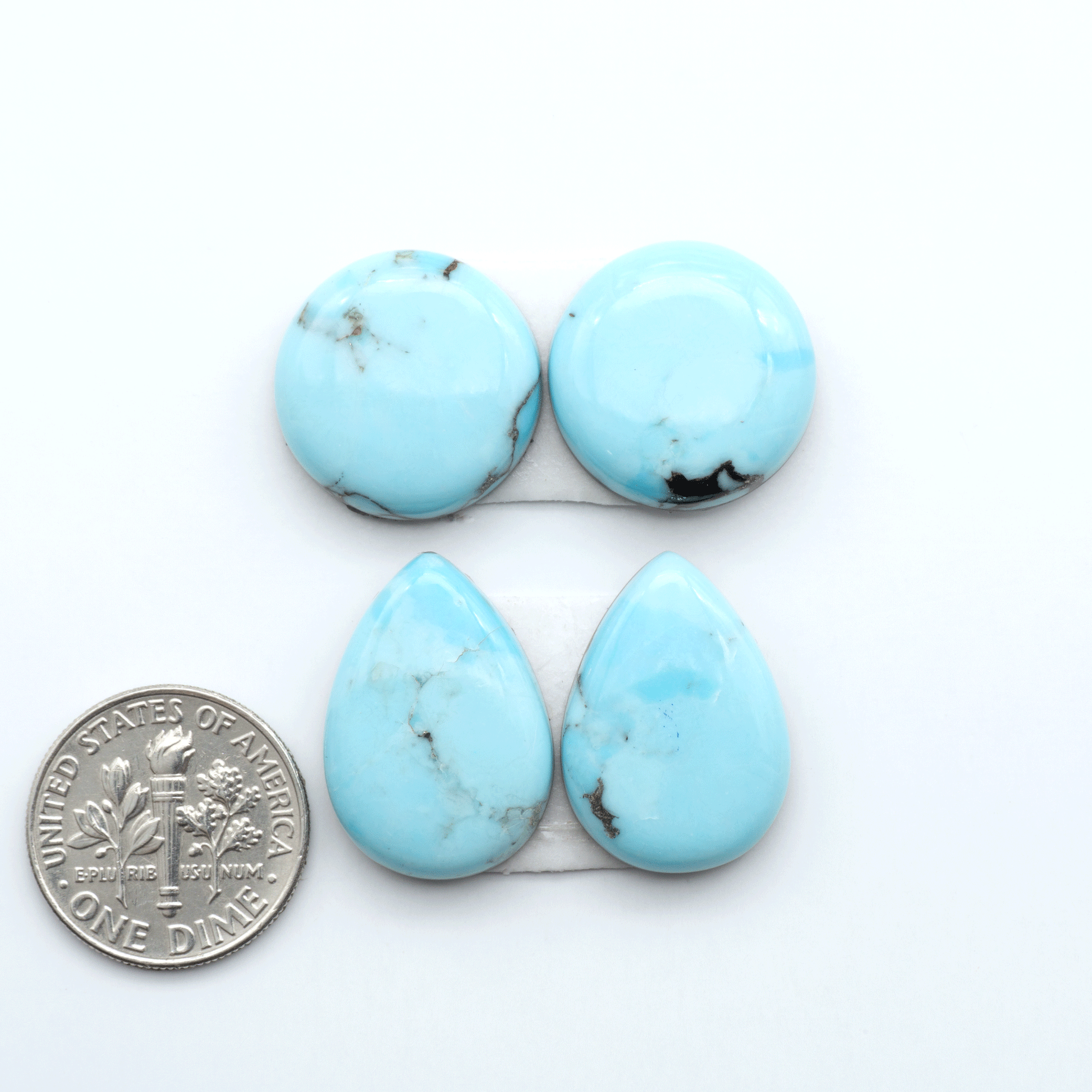 Enhance your jewelry designs with Pressed Turquoise Nugget Cabochons. Crafted from composite materials they add a captivating touch to your creations.
