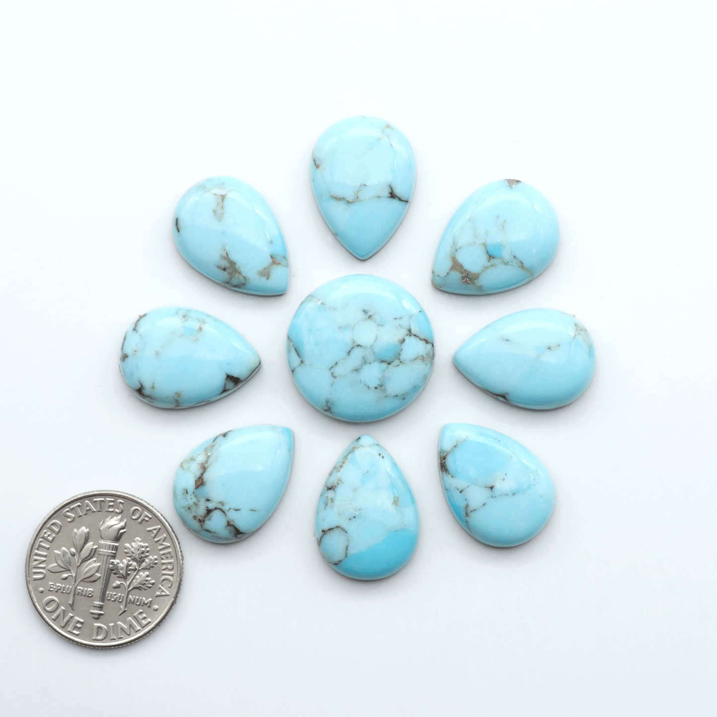 Enhance your jewelry designs with Pressed Turquoise Nugget Cabochons. Crafted from composite materials they add a captivating touch to your creations.
