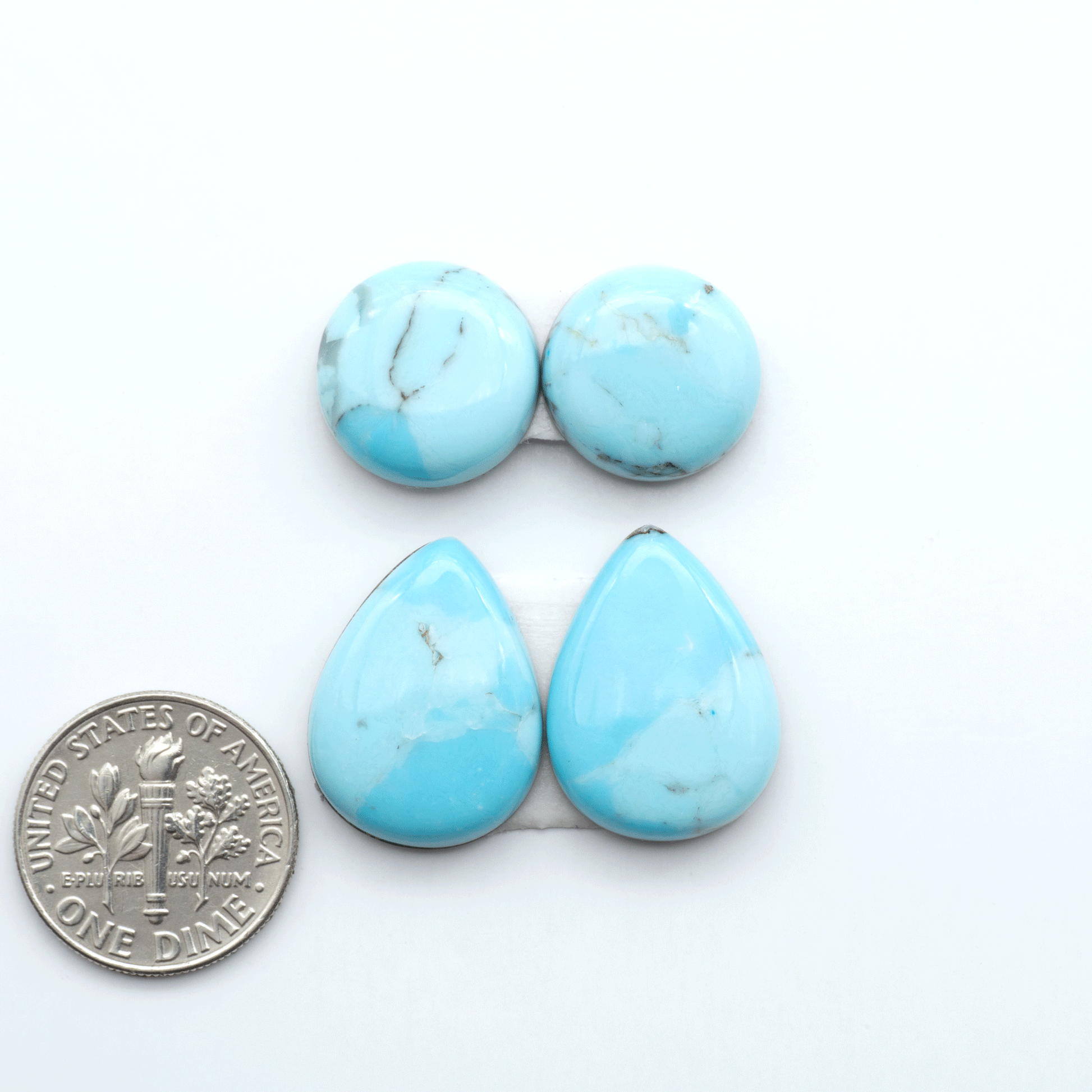 Enhance your jewelry designs with Pressed Turquoise Nugget Cabochons. Crafted from composite materials they add a captivating touch to your creations.
