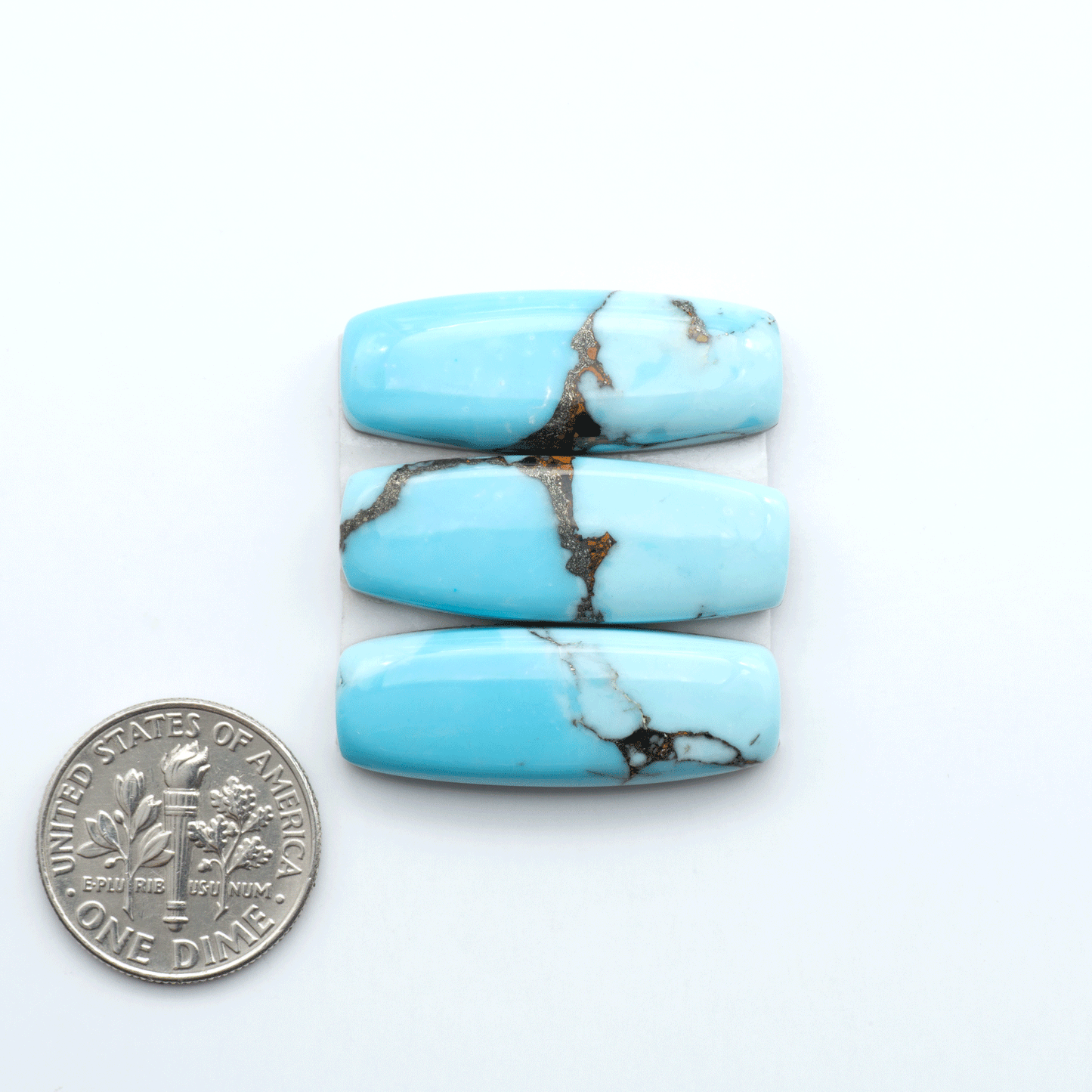 Enhance your jewelry designs with Pressed Turquoise Nugget Cabochons. Crafted from composite materials they add a captivating touch to your creations.