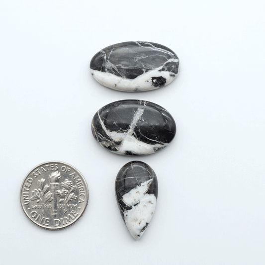 Natural White Buffalo Stone Cabochons are semi-precious gemstones cut into shapes ideal for jewelry-making, making them an excellent choice for artisans