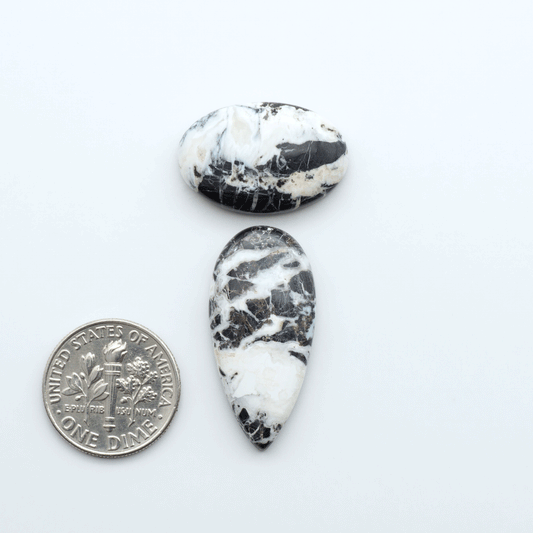 Natural White Buffalo Stone Cabochons are semi-precious gemstones cut into shapes ideal for jewelry-making, making them an excellent choice for artisans