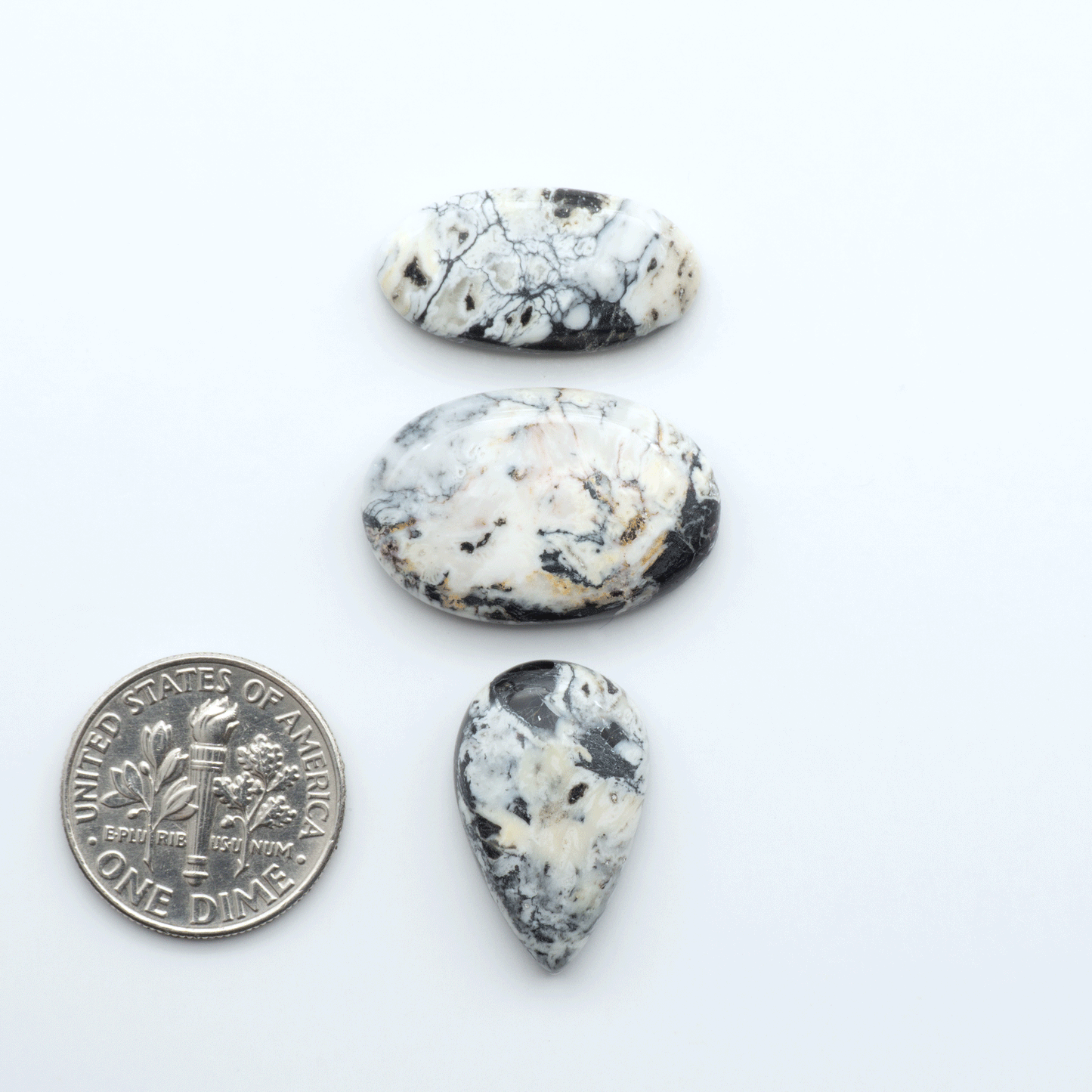 Natural White Buffalo Stone Cabochons are semi-precious gemstones cut into shapes ideal for jewelry-making, making them an excellent choice for artisans.