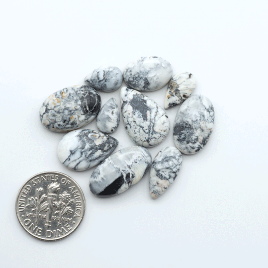 Natural White Buffalo Stone Cabochons are semi-precious gemstones cut into shapes ideal for jewelry-making, making them an excellent choice for artisans.
