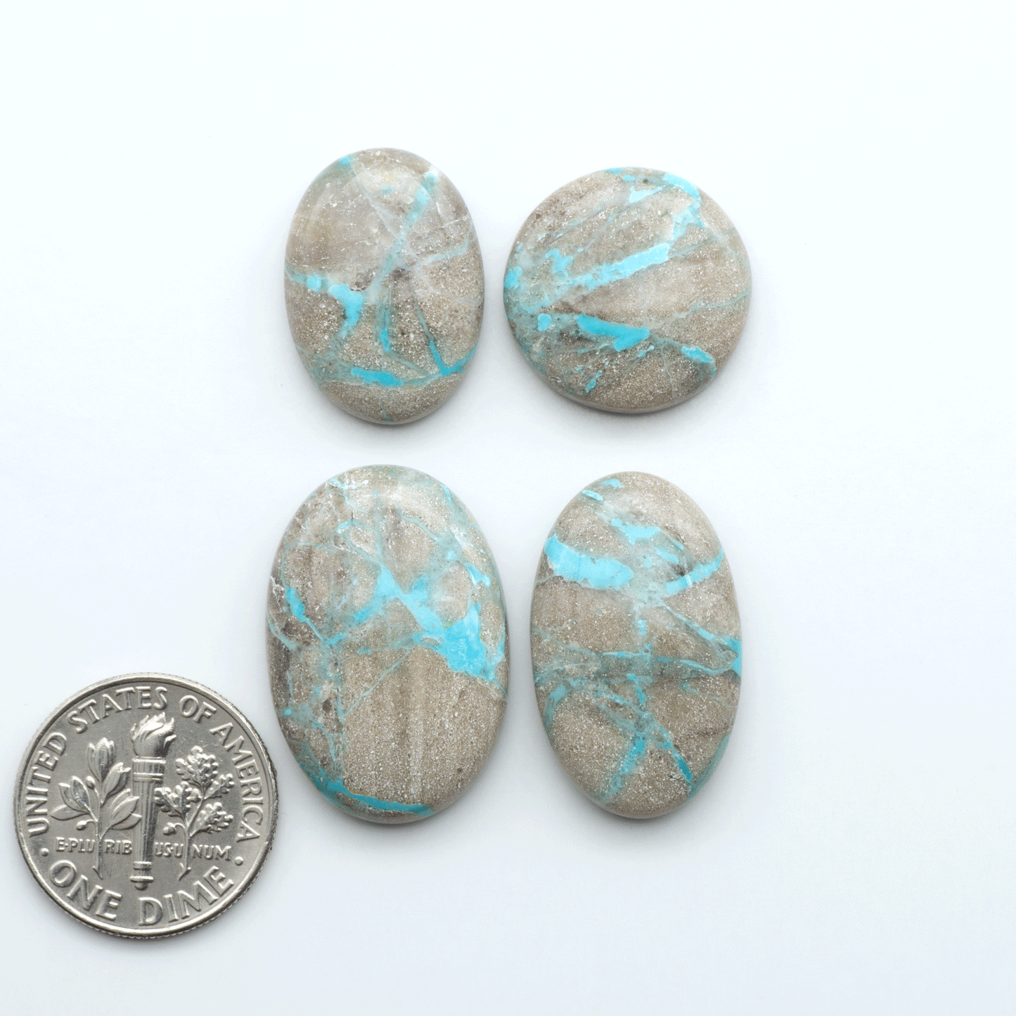 Carico Lake Turquoise cabochons with vibrant aqua-blue to turquoise tones and natural matrix, ideal for rings, pendants, and artisan jewelry.