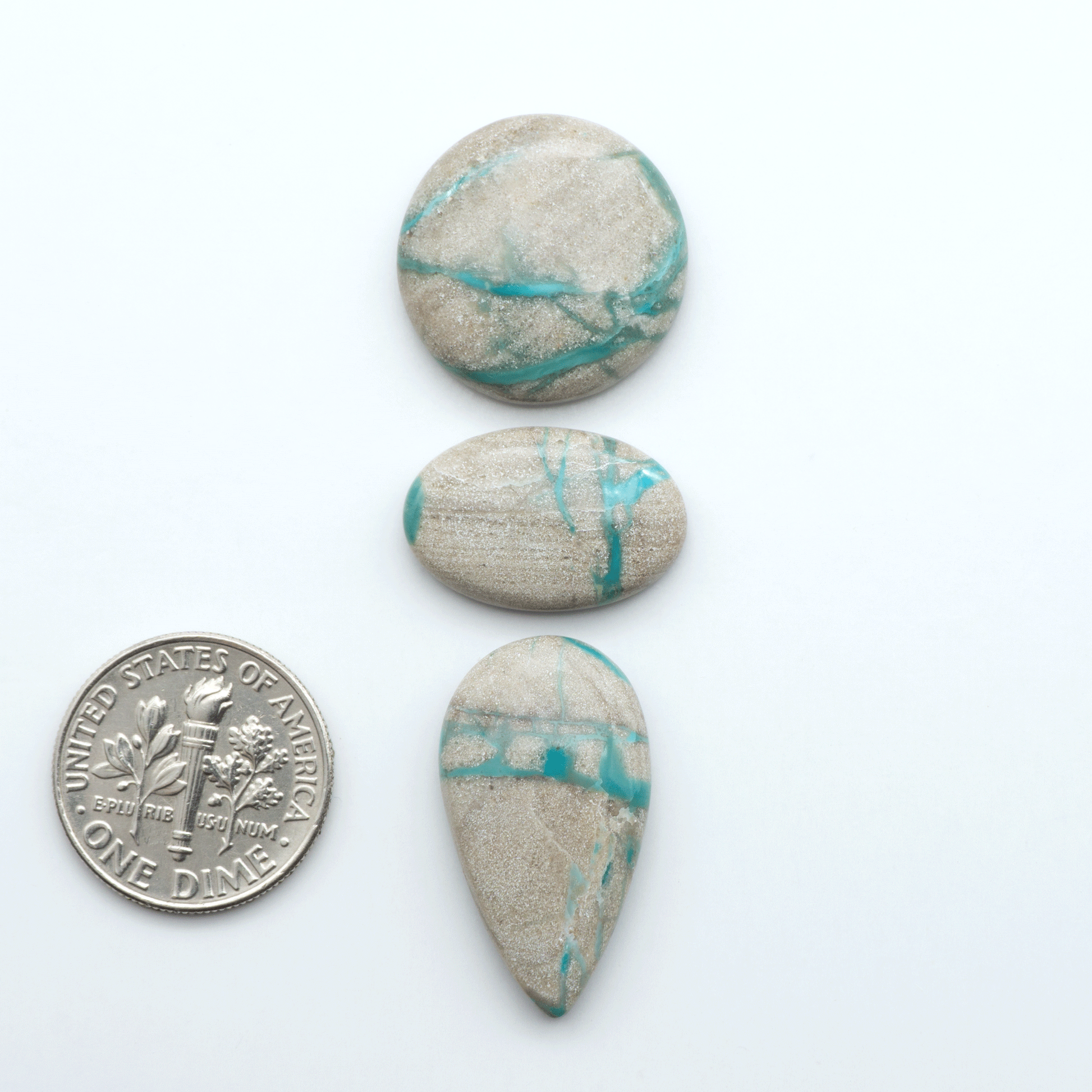 Carico Lake Turquoise cabochons with vibrant aqua-blue to turquoise tones and natural matrix, ideal for rings, pendants, and artisan jewelry.