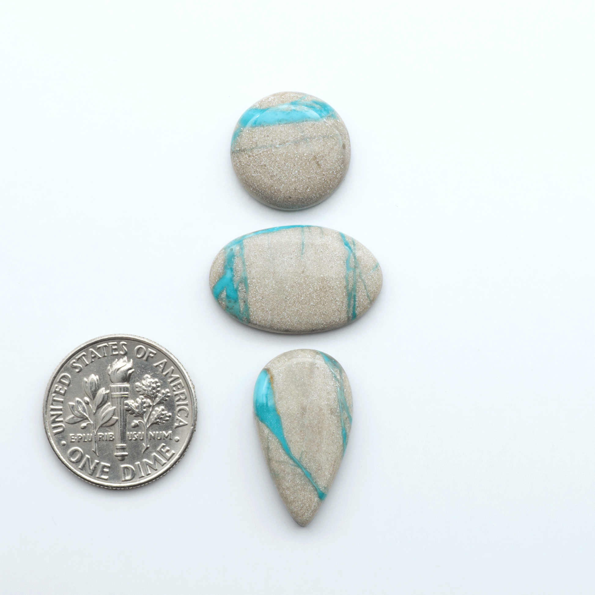 Carico Lake Turquoise cabochons with vibrant aqua-blue to turquoise tones and natural matrix, ideal for rings, pendants, and artisan jewelry.