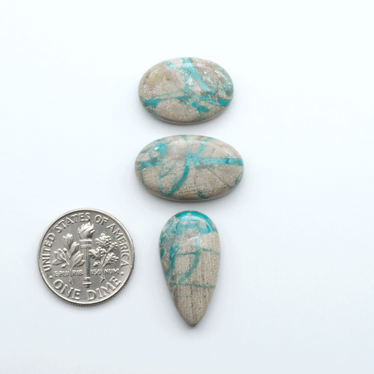 Carico Lake Turquoise cabochons with vibrant aqua-blue to turquoise tones and natural matrix, ideal for rings, pendants, and artisan jewelry.