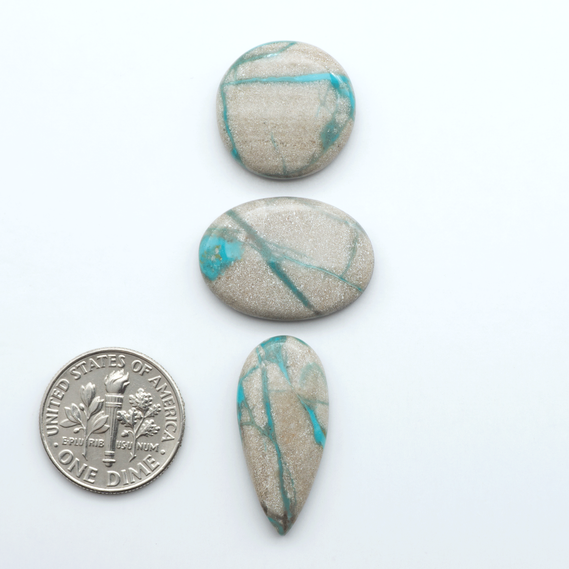 Carico Lake Turquoise cabochons with vibrant aqua-blue to turquoise tones and natural matrix, ideal for rings, pendants, and artisan jewelry.