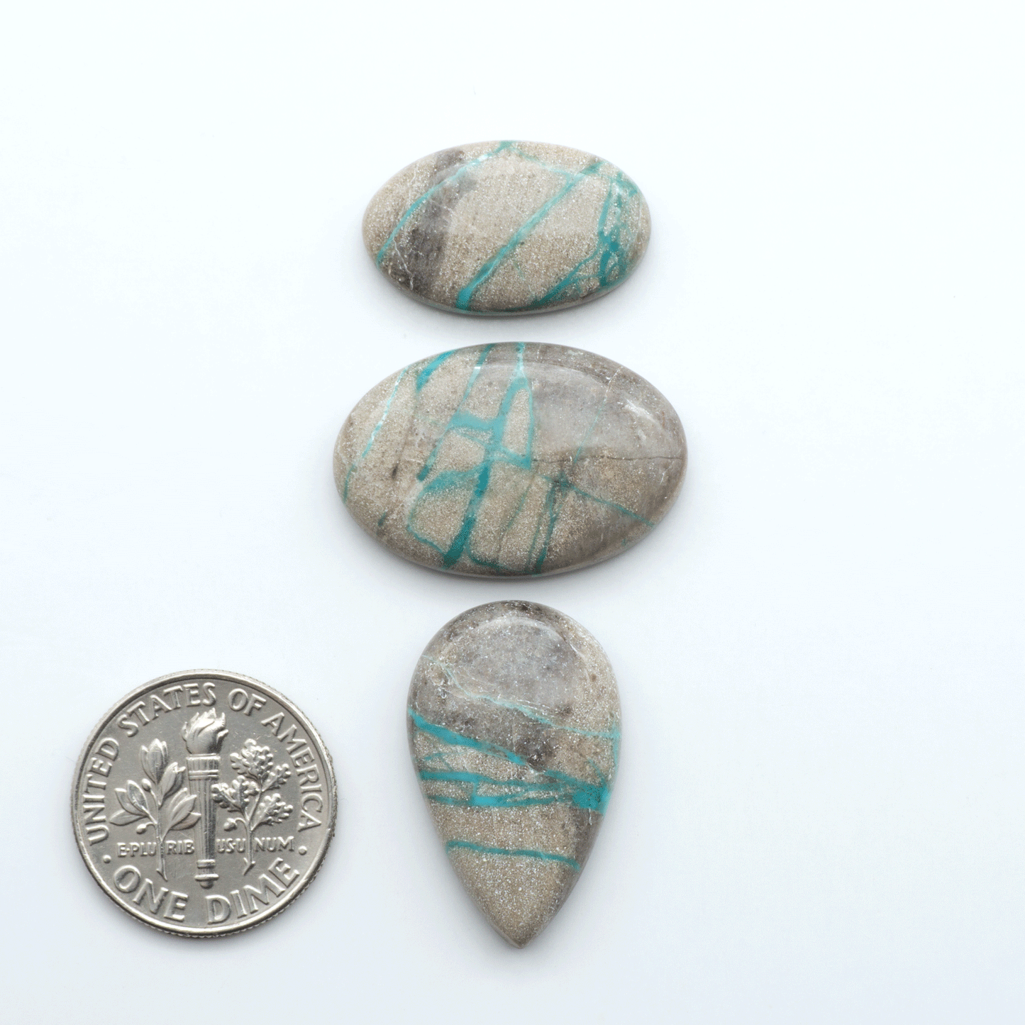 Carico Lake Turquoise cabochons with vibrant aqua-blue to turquoise tones and natural matrix, ideal for rings, pendants, and artisan jewelry.