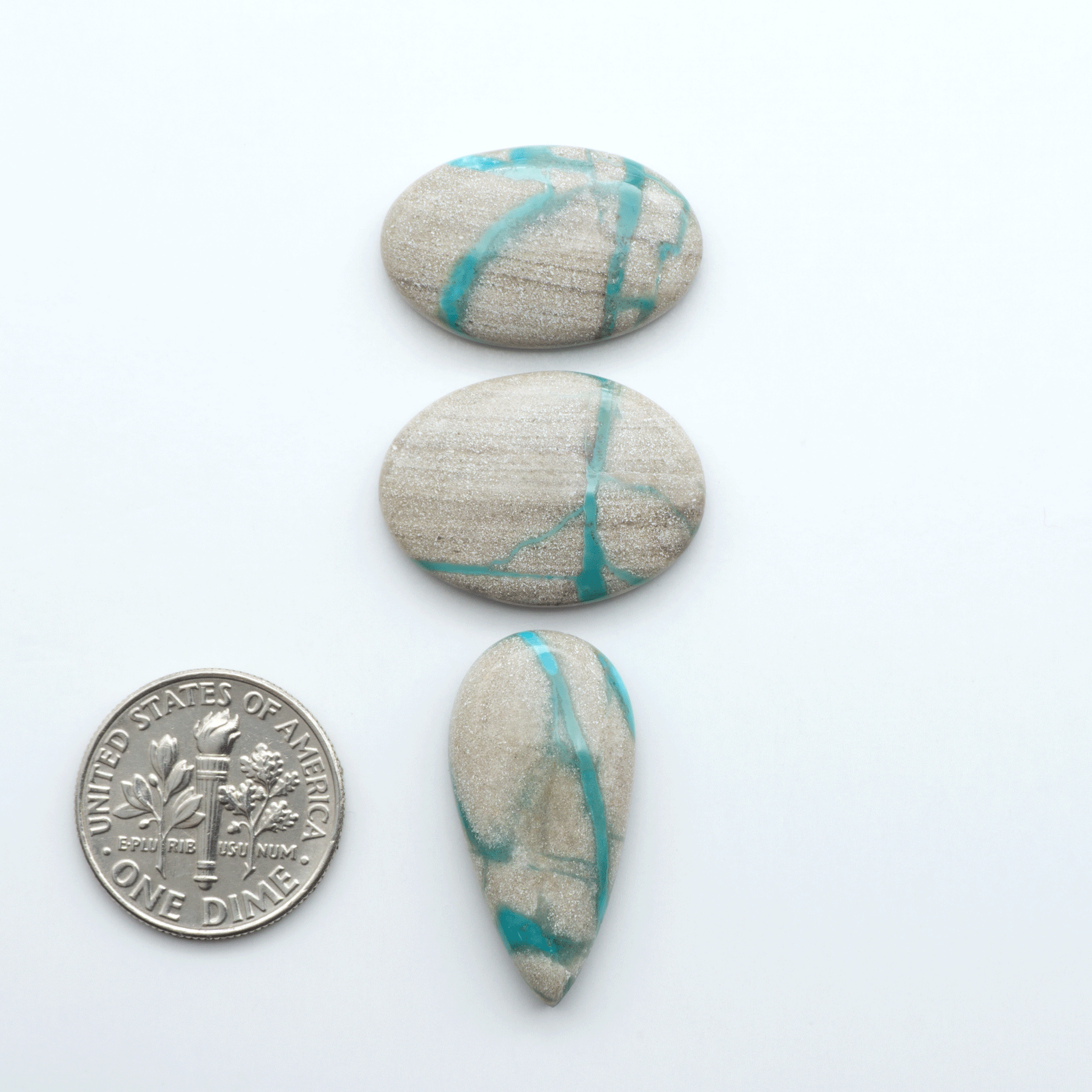 Carico Lake Turquoise cabochons with vibrant aqua-blue to turquoise tones and natural matrix, ideal for rings, pendants, and artisan jewelry.