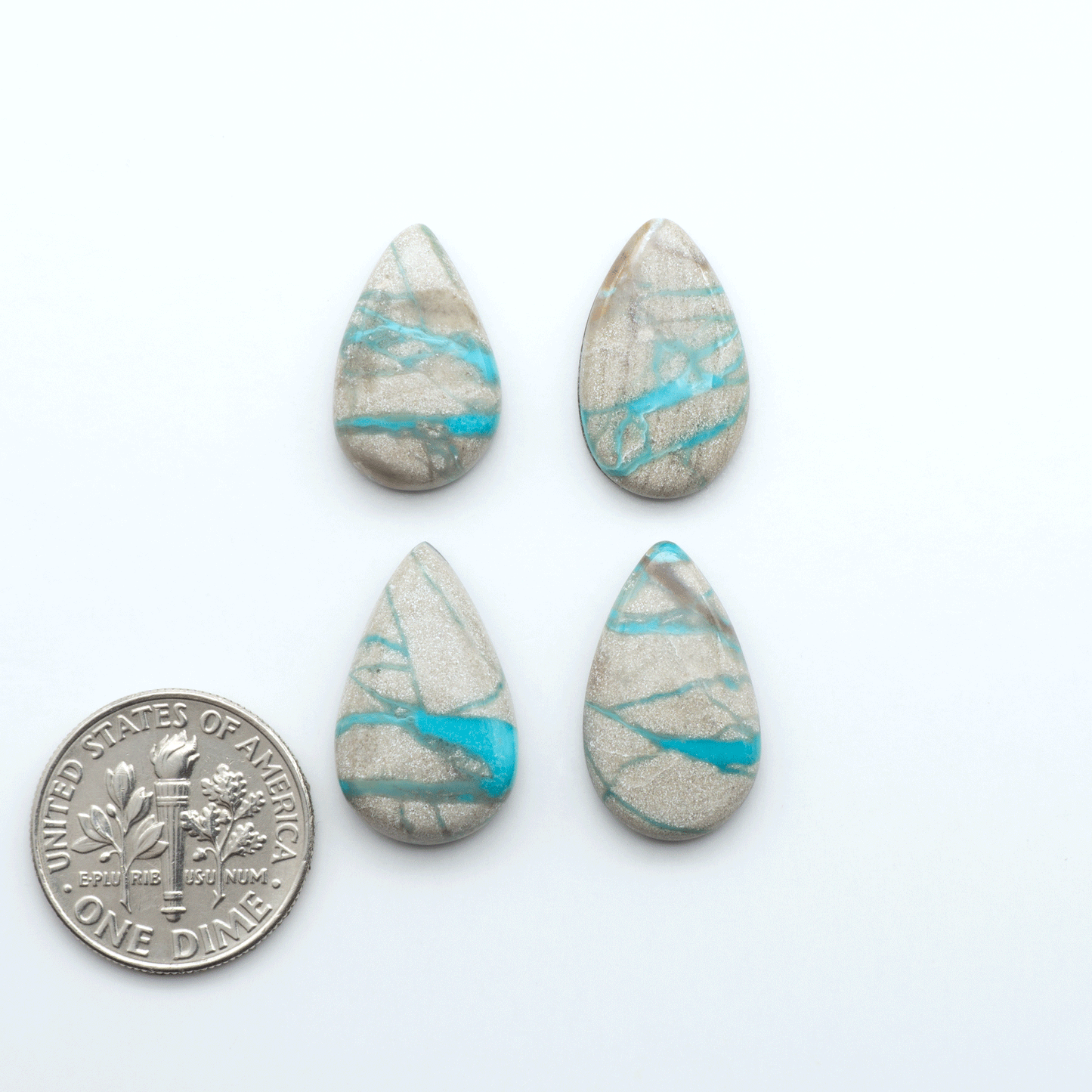 Carico Lake Turquoise cabochons with vibrant aqua-blue to turquoise tones and natural matrix, ideal for rings, pendants, and artisan jewelry.