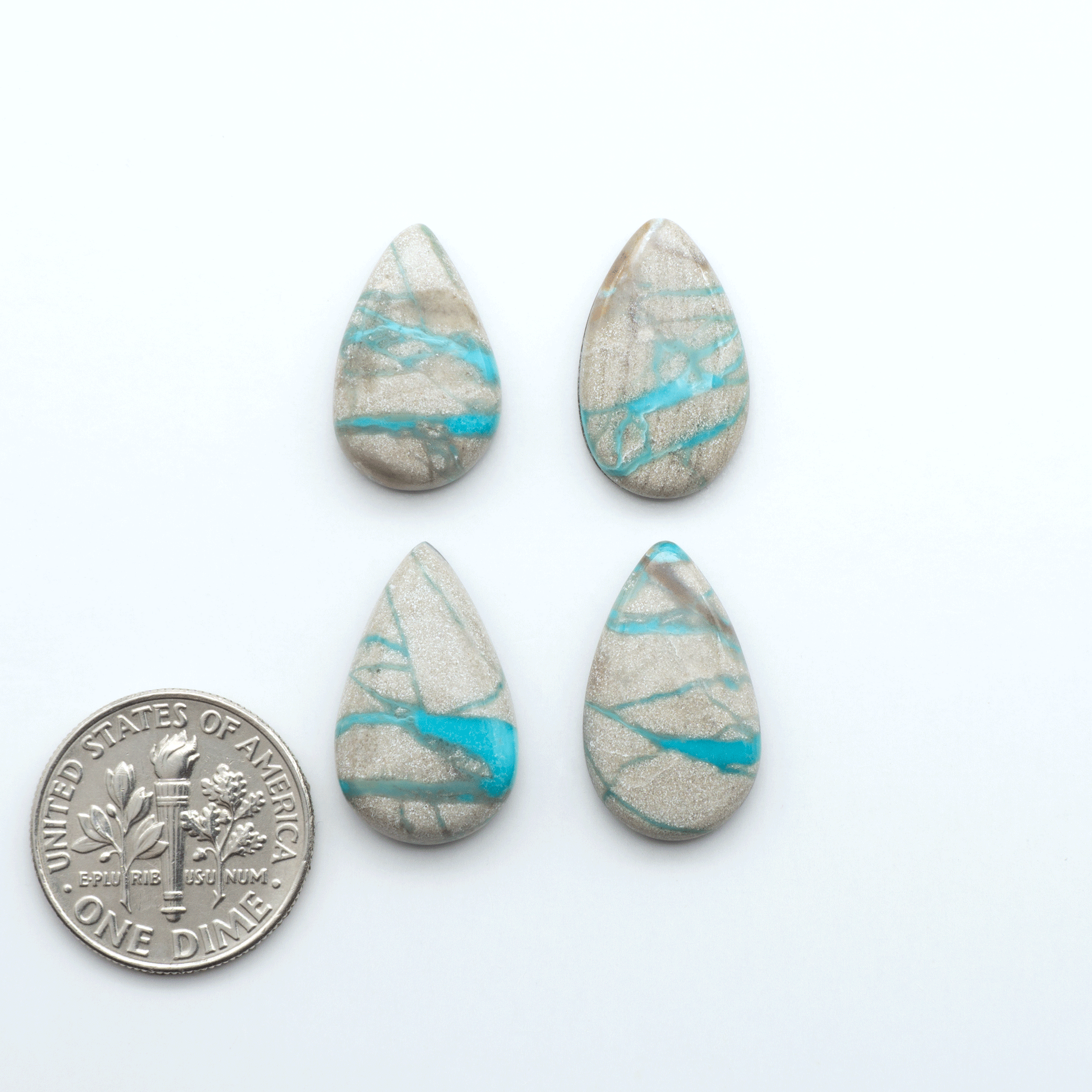 Carico Lake Turquoise cabochons with vibrant aqua-blue to turquoise tones and natural matrix, ideal for rings, pendants, and artisan jewelry.