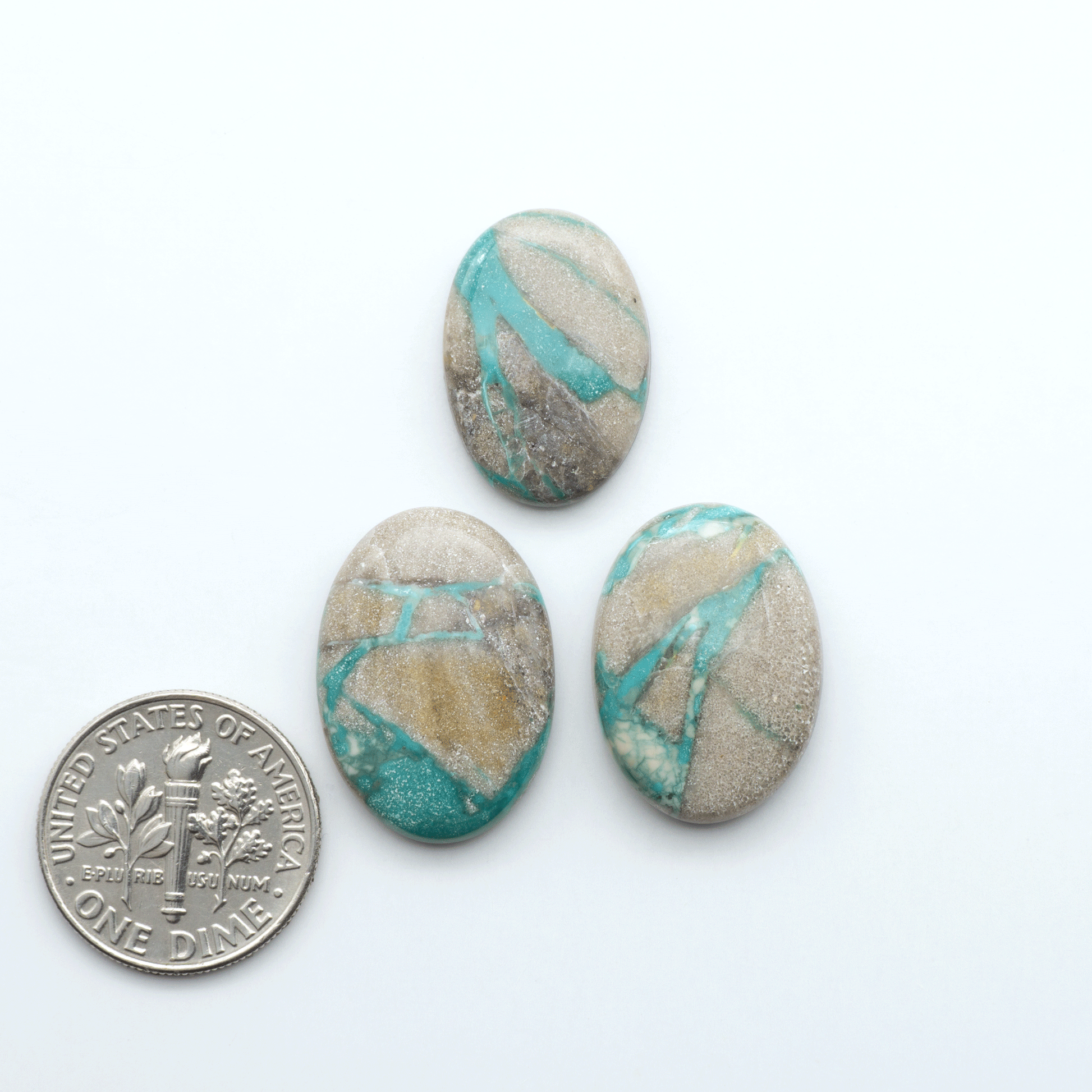 Carico Lake Turquoise cabochons with vibrant aqua-blue to turquoise tones and natural matrix, ideal for rings, pendants, and artisan jewelry.