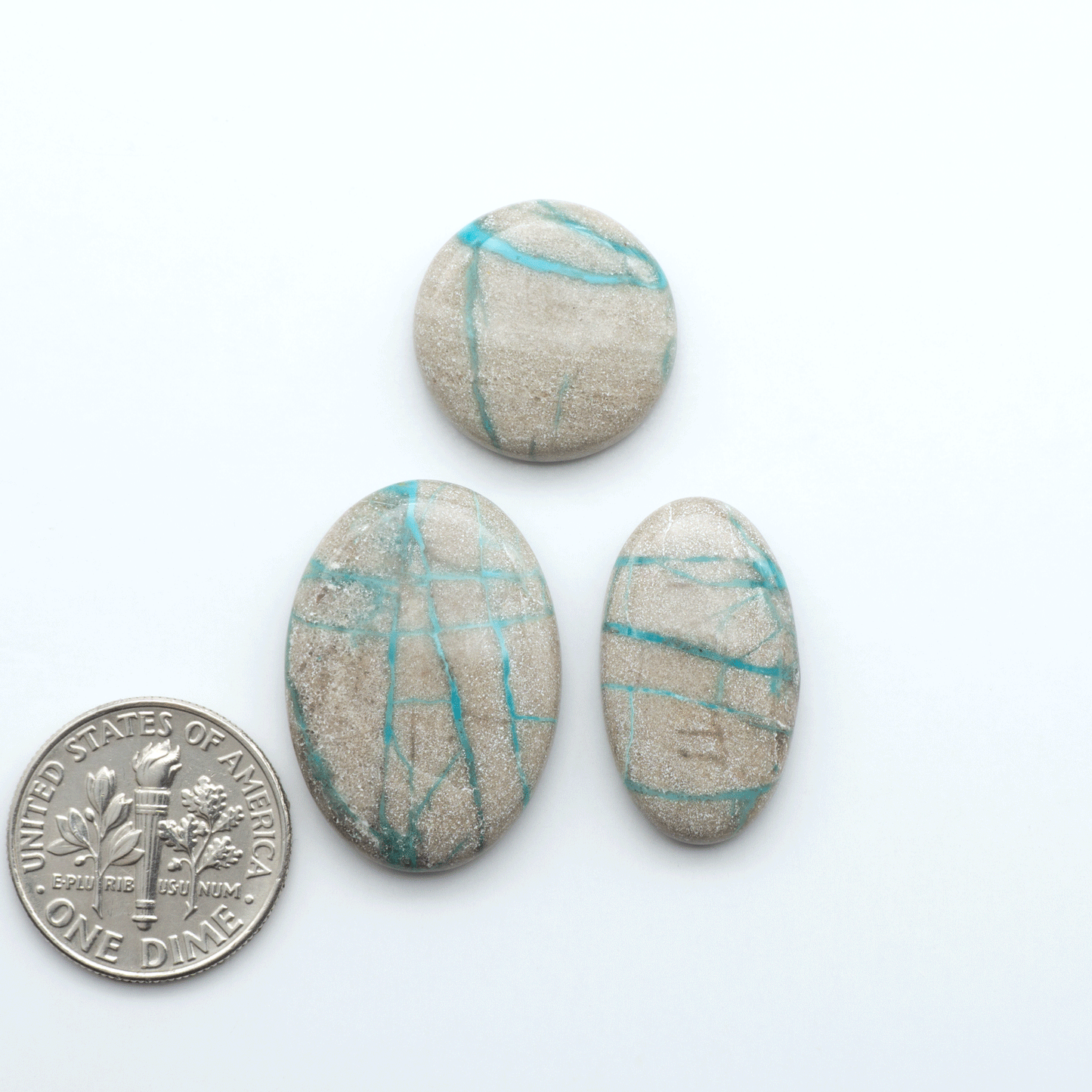 Carico Lake Turquoise cabochons with vibrant aqua-blue to turquoise tones and natural matrix, ideal for rings, pendants, and artisan jewelry.