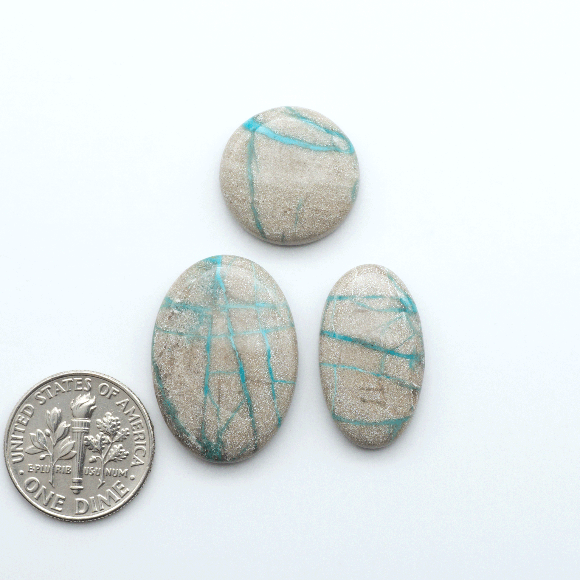 Carico Lake Turquoise cabochons with vibrant aqua-blue to turquoise tones and natural matrix, ideal for rings, pendants, and artisan jewelry.