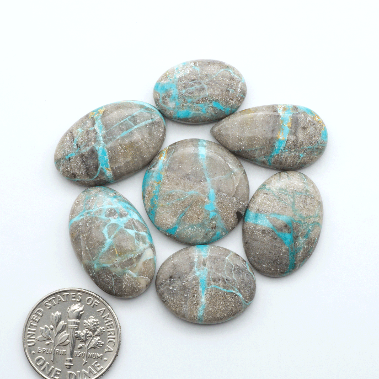 Carico Lake Turquoise cabochons with vibrant aqua-blue to turquoise tones and natural matrix, ideal for rings, pendants, and artisan jewelry.