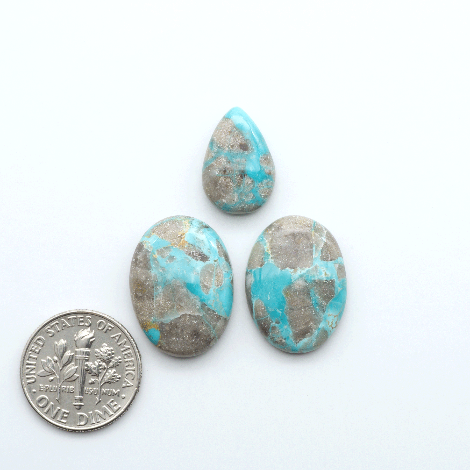 Carico Lake Turquoise cabochons with vibrant aqua-blue to turquoise tones and natural matrix, ideal for rings, pendants, and artisan jewelry.