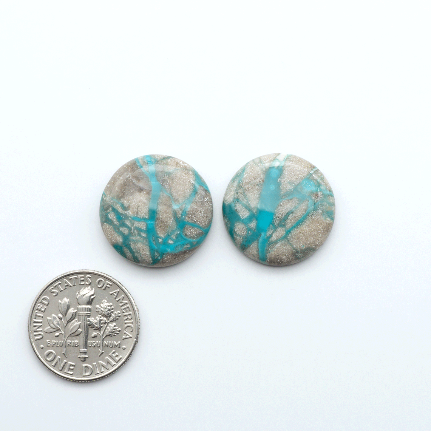 Carico Lake Turquoise cabochons with vibrant aqua-blue to turquoise tones and natural matrix, ideal for rings, pendants, and artisan jewelry.