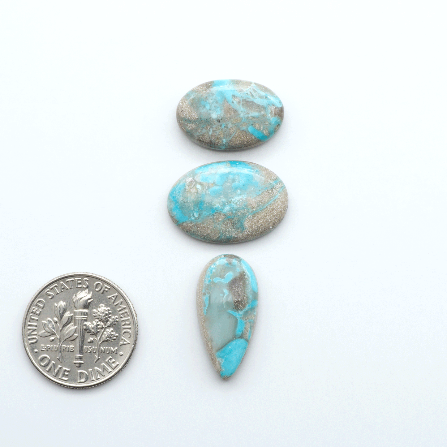 Carico Lake Turquoise cabochons with vibrant aqua-blue to turquoise tones and natural matrix, ideal for rings, pendants, and artisan jewelry.