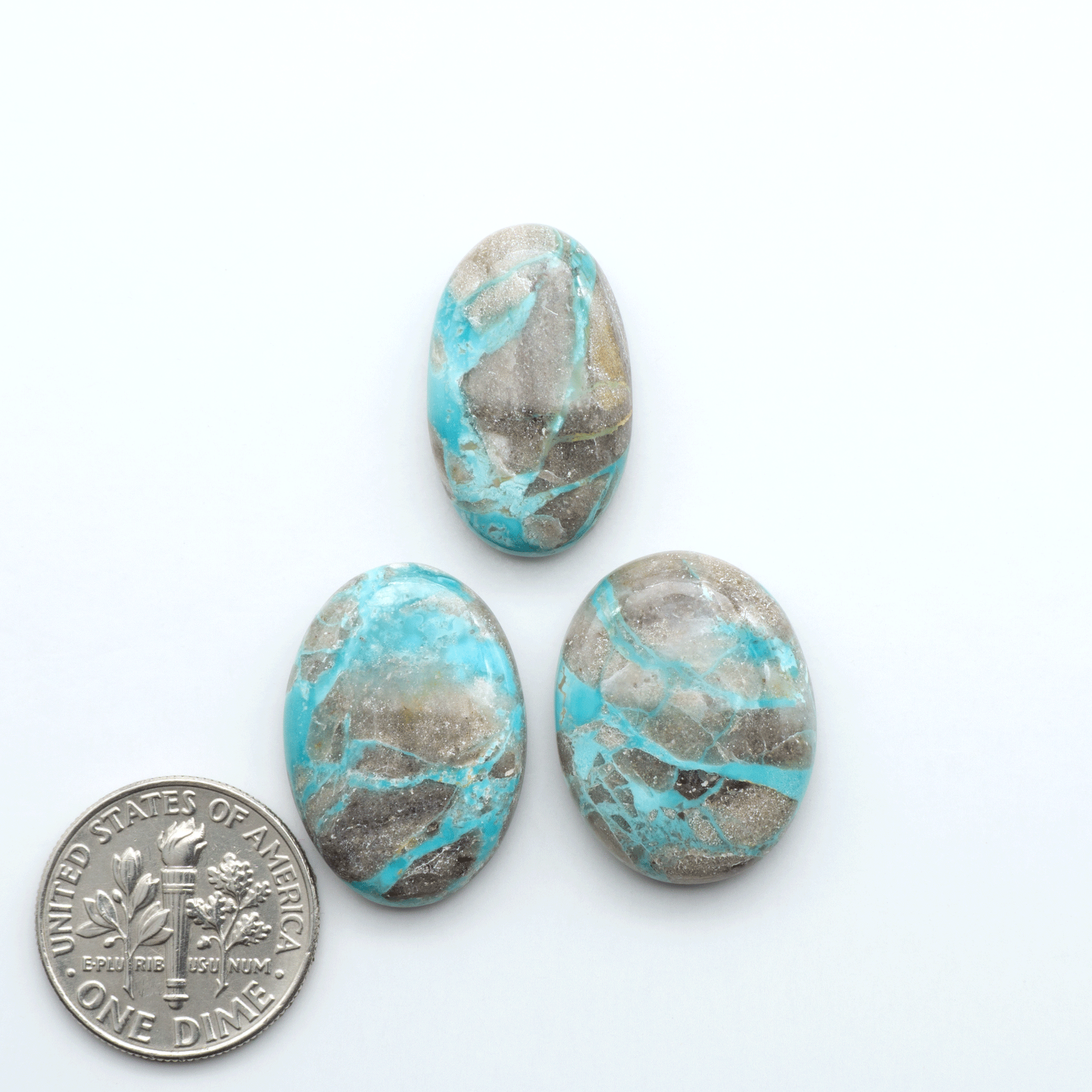 Carico Lake Turquoise cabochons with vibrant aqua-blue to turquoise tones and natural matrix, ideal for rings, pendants, and artisan jewelry.