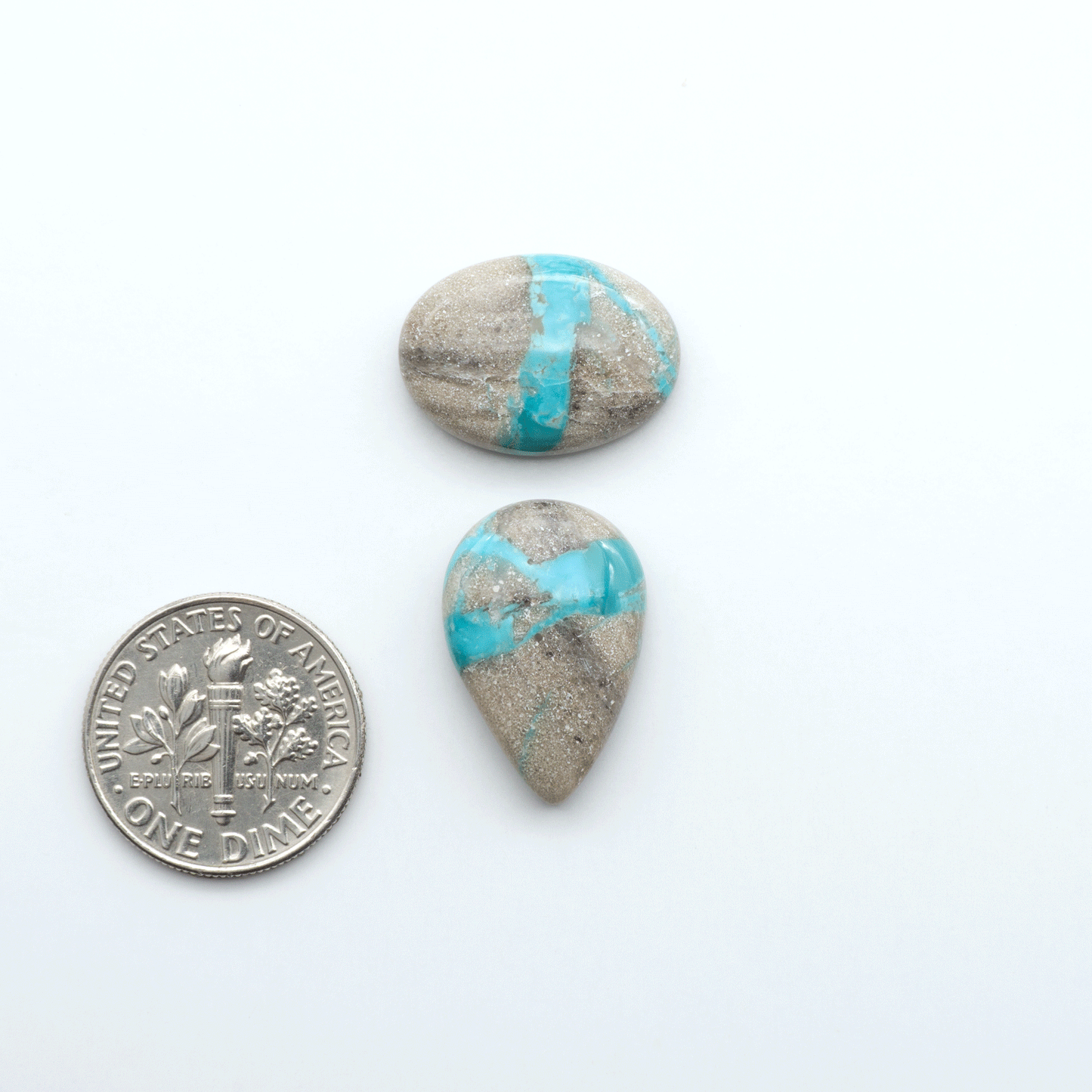 Carico Lake Turquoise cabochons with vibrant aqua-blue to turquoise tones and natural matrix, ideal for rings, pendants, and artisan jewelry.