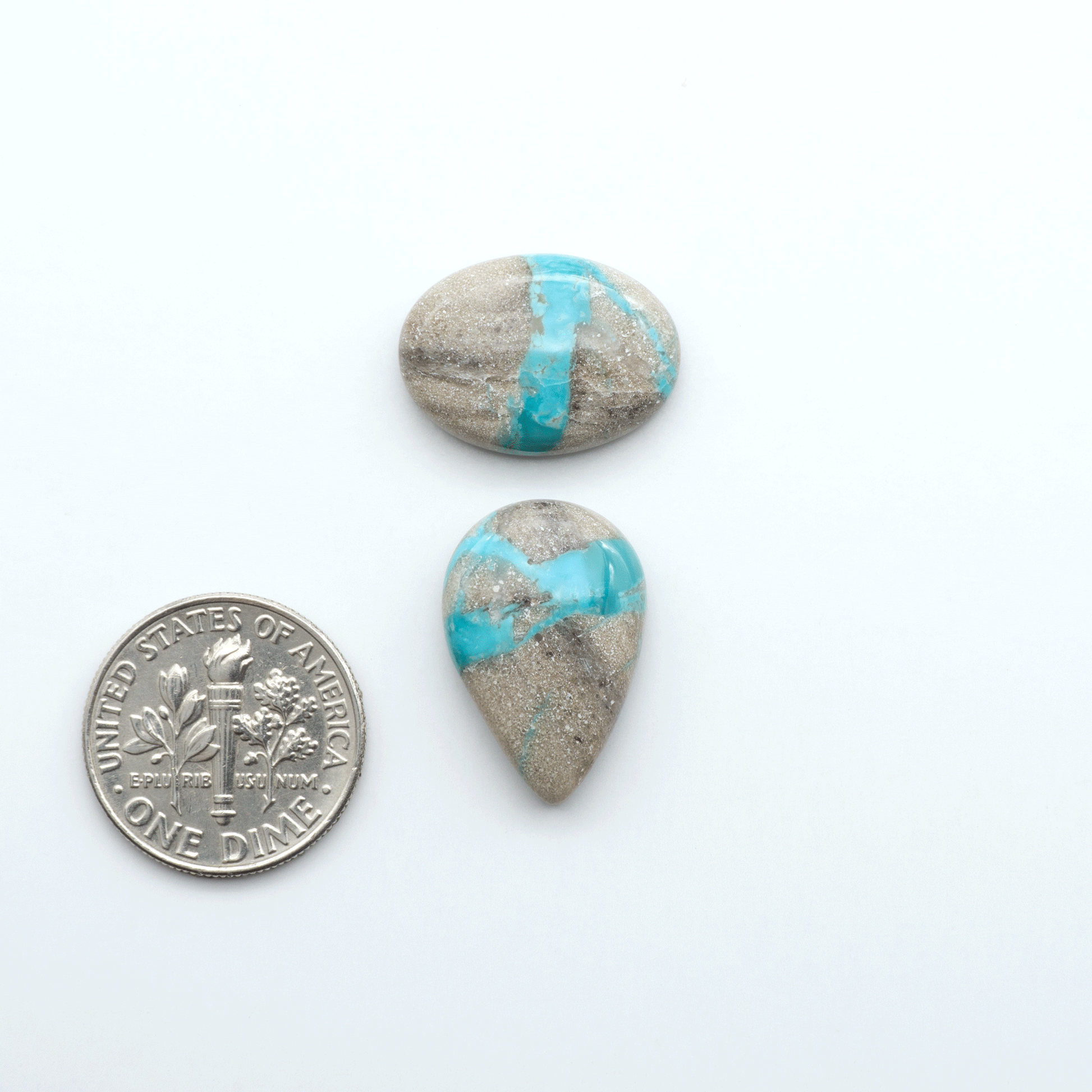 Carico Lake Turquoise cabochons with vibrant aqua-blue to turquoise tones and natural matrix, ideal for rings, pendants, and artisan jewelry.