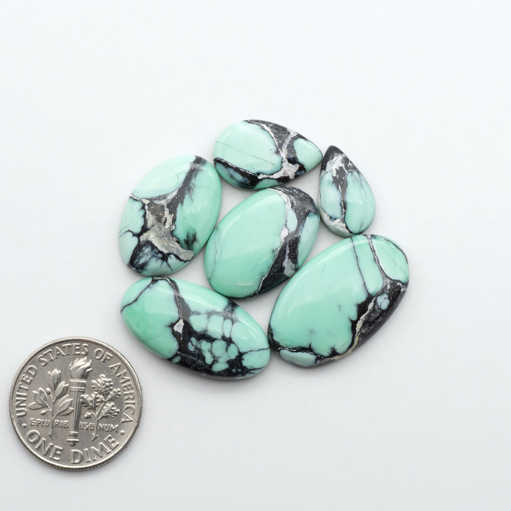 Shop Variscite cabochons with natural matrix patterns, ideal for silversmiths and jewelry makers creating custom rings and pendants.
