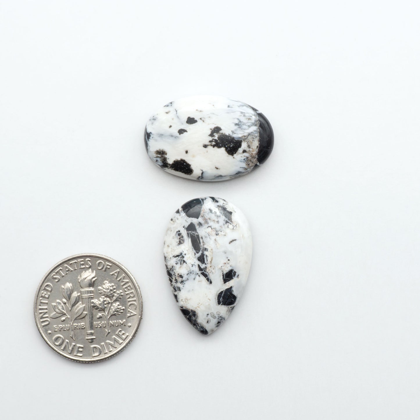 Natural White Buffalo Stone Cabochons are semi-precious gemstones cut into shapes ideal for jewelry-making, making them an excellent choice for artisans.

