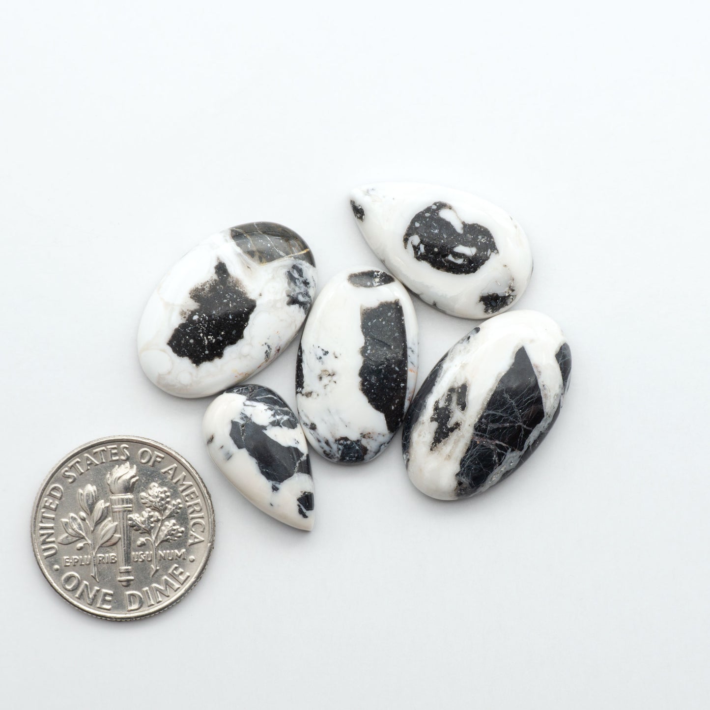 Natural White Buffalo Stone Cabochons are semi-precious gemstones cut into shapes ideal for jewelry-making, making them an excellent choice for artisans.
