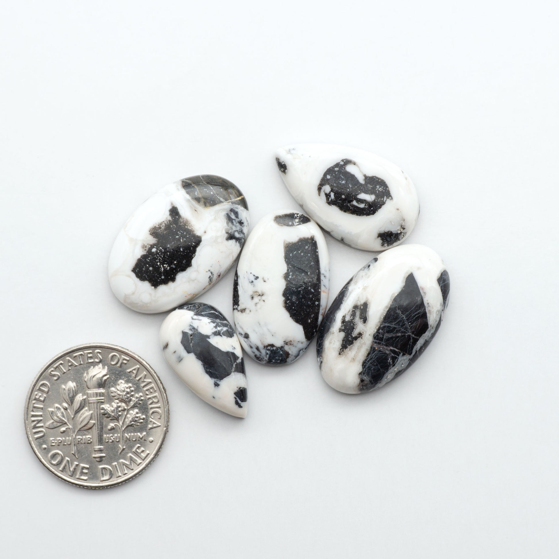 Natural White Buffalo Stone Cabochons are semi-precious gemstones cut into shapes ideal for jewelry-making, making them an excellent choice for artisans.
